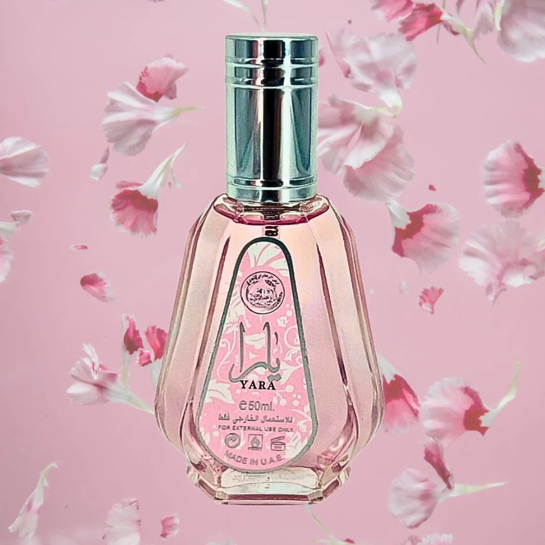 Perfume bottle with floral design on a pink background
