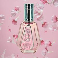 Thumbnail for Perfume bottle with floral design on a pink background